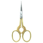 Embroidery scissors with delicate leaf print designs for crafting projects.